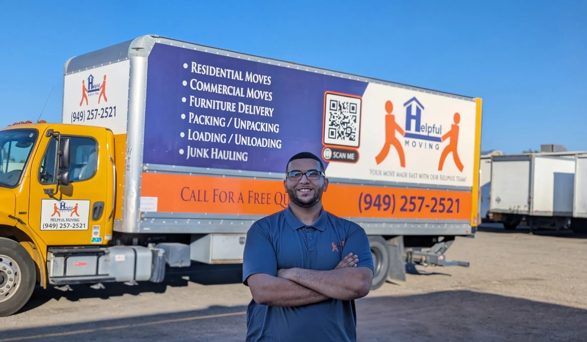 Helpful Moving professional team carefully loading furniture into moving truck